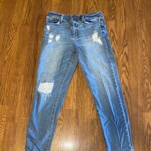 Light wash jeans with distressed spots
